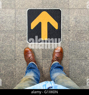 Yellow arrow to indicate the travel of the arrow Stock Photo