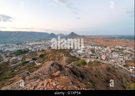 Aeriel view of Pushkar, India town after sunrise from Gayatri Temple during the dull weather. Stock Photo