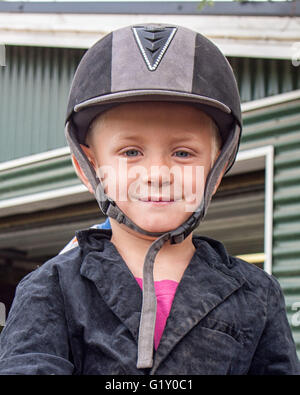 Selfoss, South Iceland, Iceland. 4th Aug, 2015. Portrait of a young boy at the Freidheimar family run farm in Selfoss, South Iceland. Besides horticulture, the family offers visitors a horse show featuring the Icelandic horse breed brought by the first settlers from Scandinavia around 900 AD. Tourism is a growing sector of the economy with Iceland becoming a favorite tourist destination. © Arnold Drapkin/ZUMA Wire/Alamy Live News Stock Photo