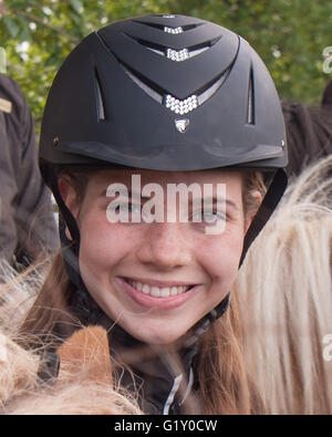 Selfoss, South Iceland, Iceland. 4th Aug, 2015. Portrait of a young girl at the Fridheimar family run farm in Selfoss, South Iceland. Besides horticulture, the family offers visitors a horse show featuring the Icelandic horse breed brought by the first settlers from Scandinavia around 900 AD. Tourism is a growing sector of the economy with Iceland becoming a favorite tourist destination. © Arnold Drapkin/ZUMA Wire/Alamy Live News Stock Photo