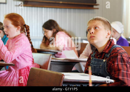 Miles, Iowa, USA. 19th May, 2016. Johnny Portz listens to instructions for the days lessons at the old Teeds Grove No. 3 School located at the Threshing Grounds in Miles, Iowa Thursday, May 19, 2016. Credit:  Kevin E. Schmidt/Quad-City Times/ZUMA Wire/Alamy Live News Stock Photo