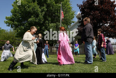 Miles, Iowa, USA. 19th May, 2016. Jaden Denger, left chases Bailey Reuter during a game of Drop The Hanky during the day at the old Teeds Grove No. 3 School at the Threshing Grounds in Miles, Iowa Thursday, May 19, 2016. Credit:  Quad-City Times/ZUMA Wire/Alamy Live News Stock Photo