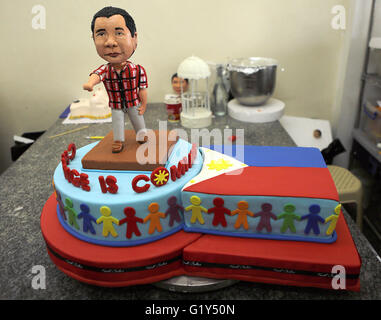 Quezon City. 21st May, 2016. Photo taken on May 21, 2016 shows a cake featuring presumptive Philippine president-elect Rodrigo Duterte at a bakeshop in Quezon City, the Philippines. The cake is made to celebrate a large portion of almost 16 million votes Rodrigo Duterte won during the Philippine presidential election. © Rouelle Umali/Xinhua/Alamy Live News Stock Photo