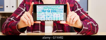 Thank you in different languages on a smartphone's touchscreen Stock Photo