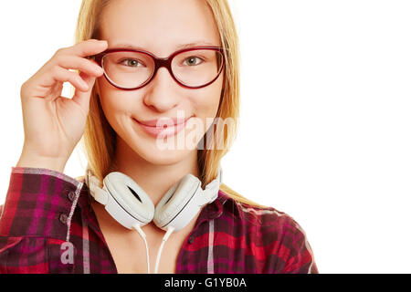 Smiling girl with her hand on her glasses Stock Photo