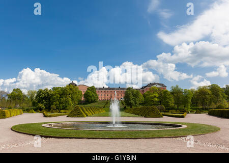 Uppsala, Sweden - May 20, 2016 : Distant view of the Uppsala Castle from the botanic garden including fountains. Stock Photo