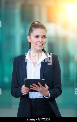 Businesswoman using a digital tablet Stock Photo