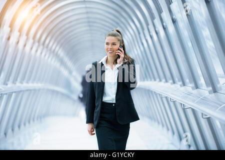 Businesswoman talking on mobile phone Stock Photo