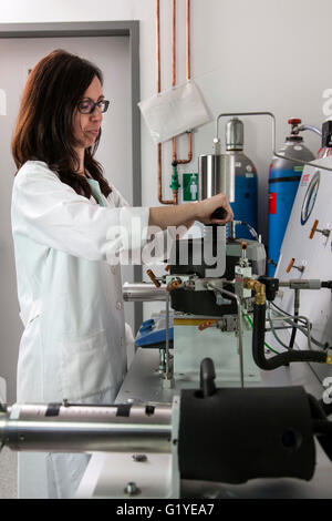 Geologist at the high-pressure apparatus in the laboratory. Stock Photo