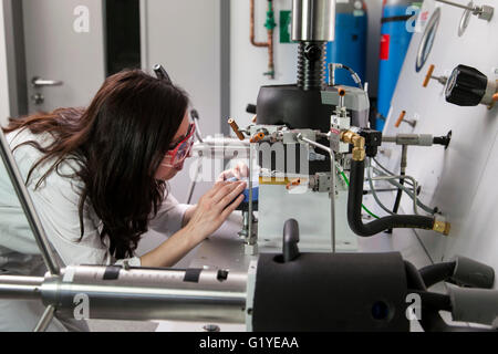 Geologist at the high-pressure apparatus in the laboratory. Stock Photo