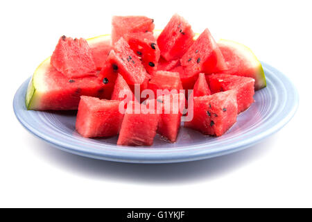 Watermelon cuts and slices on a light blue plate, on white Stock Photo