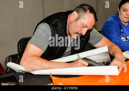 Ken Kirzinger, who played Jason Voorhees in the 2003 film 'Freddy vs. Jason' signs autographs for fans at Comicon Belfast, Northern Ireland, 14 May 2016 Stock Photo