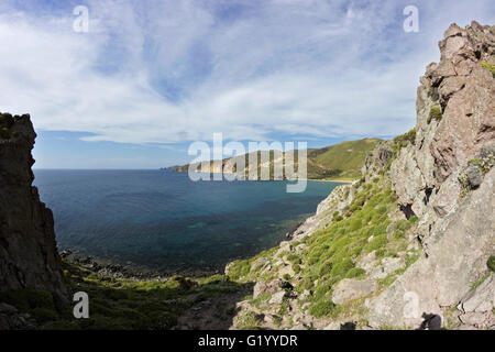 Karvounolakas beach seen from the mountainuous hillside of Prophet Elias chapel. Stipsis area afar. Stock Photo