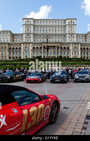 Super cars of the exclusive Gumboil 3000 parked in front of the Romanian Parliament. Gumball is an international celebrity rally