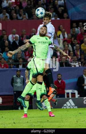 Nicolas Otamendi of Manchester City (C ) fights for the ball with Fernando Llorente of Sevilla during the UEFA Champions League Group D soccer match between Sevilla FC and Manchester City at Estadio Ramon Sanchez Pizjuan in Sevilla, Spain, 3 November, 2015 Stock Photo