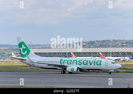 Aircraft -Boeing 737- of -Transavia airlines- airline, direction to airport terminal of Madrid airport. Stock Photo