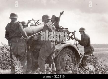 German Soldiers load a Nebelwerfer Rocket launcher in the summer 1943 on the Eastern Front Stock Photo