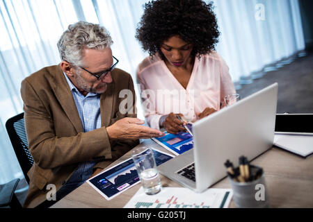 Two businessmen working on a computer Stock Photo