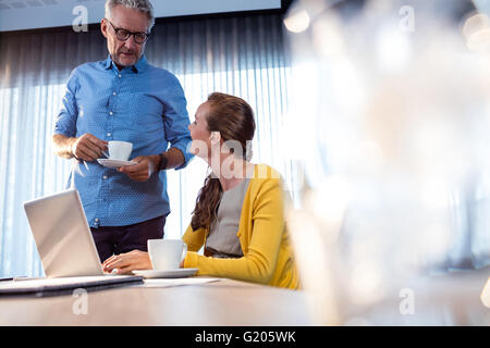 Two businessmen having a break at work Stock Photo