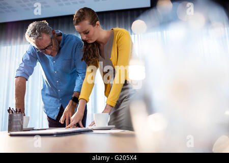 Two businessmen pointing at documents Stock Photo