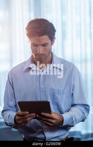 Businessman using a tablet computer Stock Photo