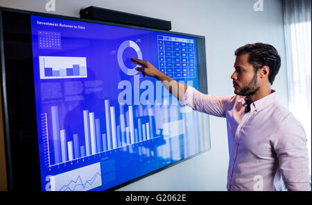 Businessman analyzing data with a touch screen Stock Photo