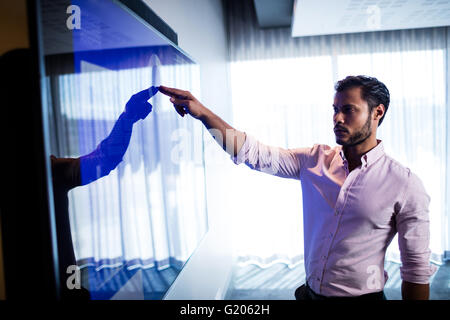 Businessman using touch screen Stock Photo