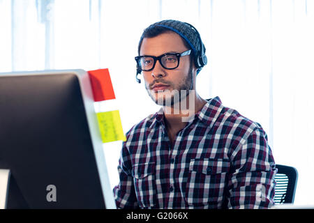 Portrait of man wearing headset Stock Photo