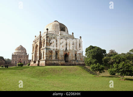 The Shish-Gumbad Tomb (foreground) and the Bara-Gumbad Tomb (background) in Lodi Gardens, New Delhi, India. Stock Photo