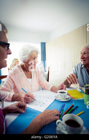 Group of seniors drawing and interacting Stock Photo