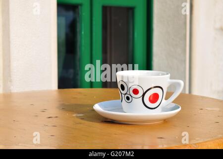 White coffee cup on a brown wooden table Stock Photo