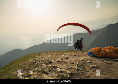 A paraglider flyer gets ready for take off at Bir Billing, Himachal Pradesh Stock Photo