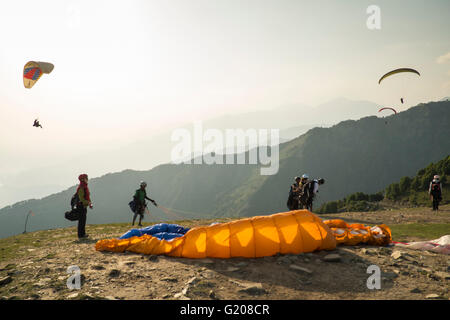 A paraglider flyer gets ready for take off at Bir Billing, Himachal Pradesh Stock Photo