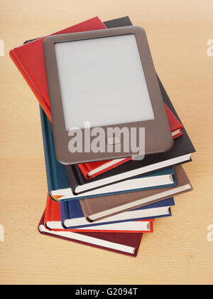 e-book reader on pile of books Stock Photo