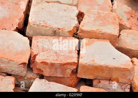 Detail of some old used bricks in stack Stock Photo