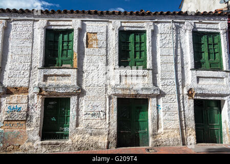 Historic white and green building in La Candelaria neighborhood in Bogota, Colombia Stock Photo