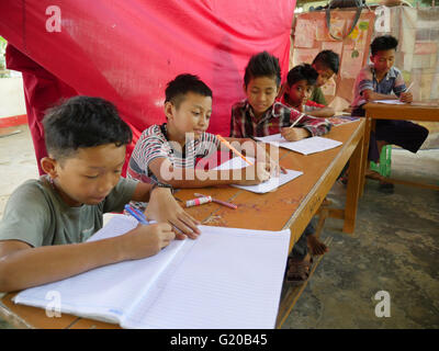 MYANMAR Saint Rita's boarding house for girls and boys at Maubin. The children, coming from remote villages, stay here so they can attend local schools. Class taught by Thuzer Win. Stock Photo