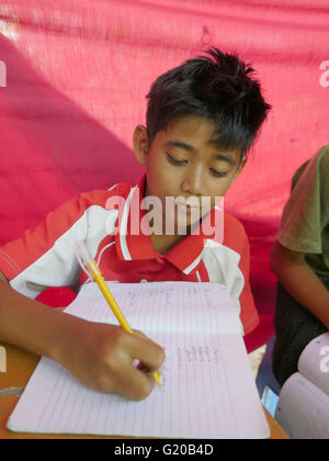 MYANMAR Saint Rita's boarding house for girls and boys at Maubin. The children, coming from remote villages, stay here so they can attend local schools. Class taught by Thuzer Win. Stock Photo