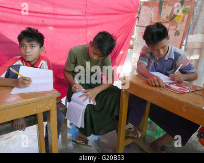 MYANMAR Saint Rita's boarding house for girls and boys at Maubin. The children, coming from remote villages, stay here so they can attend local schools. Class taught by Thuzer Win. Stock Photo