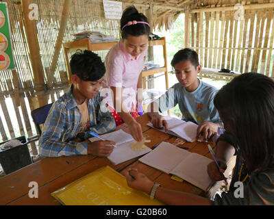 MYANMAR Saint Rita's boarding house for girls and boys at Maubin. The children, coming from remote villages, stay here so they can attend local schools. Class taught by Margaret Melon. Stock Photo