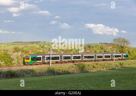 A London Midland train on the Redditch to Lichfield Trent Valley railway line near Alvechurch, Worcstershire, England, UK Stock Photo