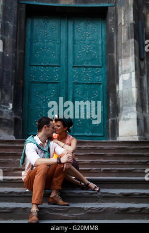 embrace couple is hugging on the background old door Stock Photo