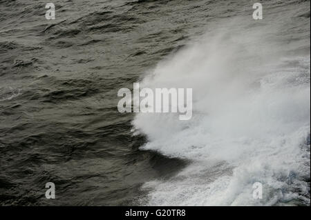 waves on the side of a ship at sea Stock Photo