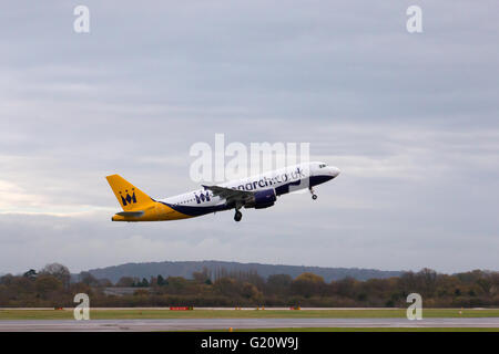 Monarch Airlines Airbus A320 narrow-body passenger plane (G-OZBY) departing from Manchester International Airport runway. Stock Photo
