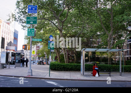 A bus stop on Frankfort Street near Water Street in the South Street Seaport, Manhattan, New York City. Stock Photo
