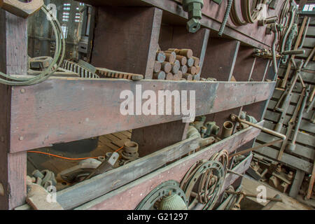 Bins of rusty tools in old wooden workroom Stock Photo