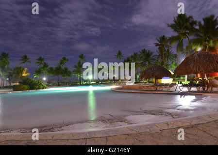 Swimming pool at Caribbean Princess Resorts & Spa at dusk, Punta Cana, Dominican Republic Stock Photo