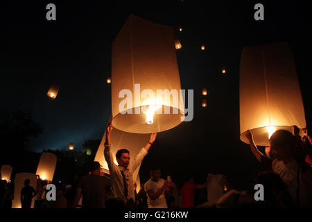 Magelang, Indonesia. 21st May, 2016. Buddhist followers release lanterns into the air on Borobudur temple during celebrations for Vesak Day on May 21, 2016 in Magelang, Central Java, Indonesia. Vesak is observed during the full moon in May or June with the ceremony centered around three Buddhist temples, pilgrims walk from Mendut to Pawon, ending at Borobudur. The holy day celebrates the birth, the enlightenment to nirvana, and the passing of Gautama Buddha's, the founder of Buddhism. Credit:  Slamet Riyadi/ZUMA Wire/Alamy Live News Stock Photo