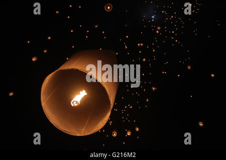 Magelang, Indonesia. 21st May, 2016. Lanterns fly into the air at Borobudur temple during celebrations for Vesak Day on May 21, 2016 in Magelang, Central Java, Indonesia. Vesak is observed during the full moon in May or June with the ceremony centered around three Buddhist temples, pilgrims walk from Mendut to Pawon, ending at Borobudur. The holy day celebrates the birth, the enlightenment to nirvana, and the passing of Gautama Buddha's, the founder of Buddhism. Credit:  Slamet Riyadi/ZUMA Wire/Alamy Live News Stock Photo