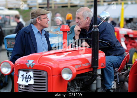 Royal Welsh Spring Festival, May 2016 - Farmers enjoy a chat as they await the signal to start engines for the classic vehicle and vintage tractor parade in the main display arena on the second day of the Royal Welsh Spring Festival, Powys Wales. Stock Photo